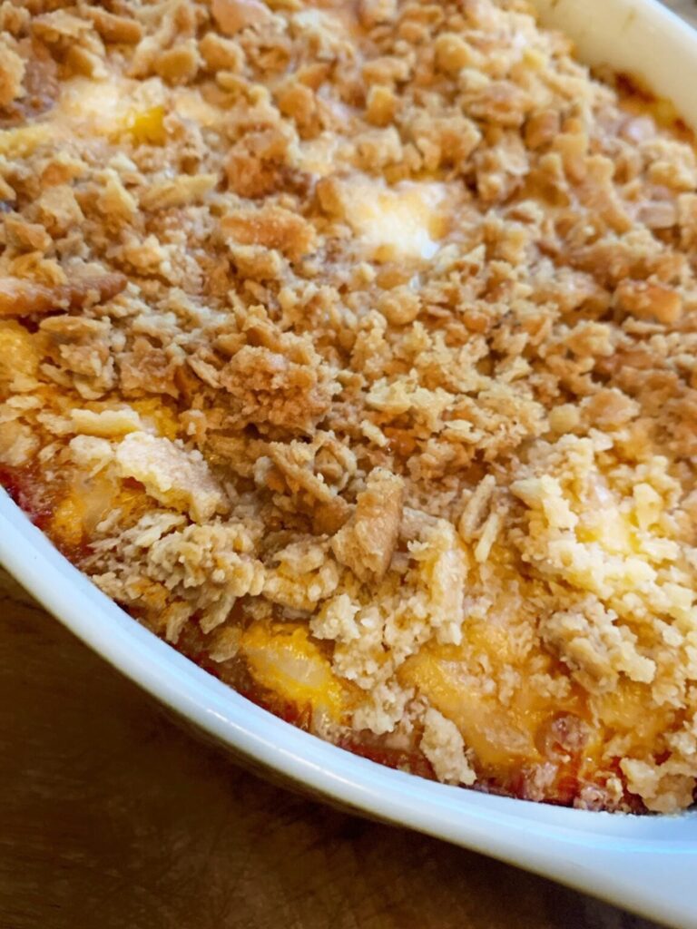 a dish baked with scalloped corn and topped with buttered ritz crackers