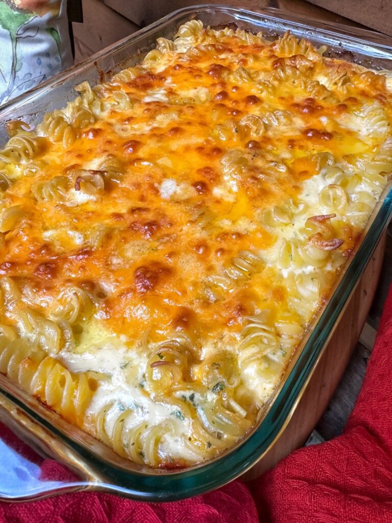 a casserole dish with baked macaroni and cheese