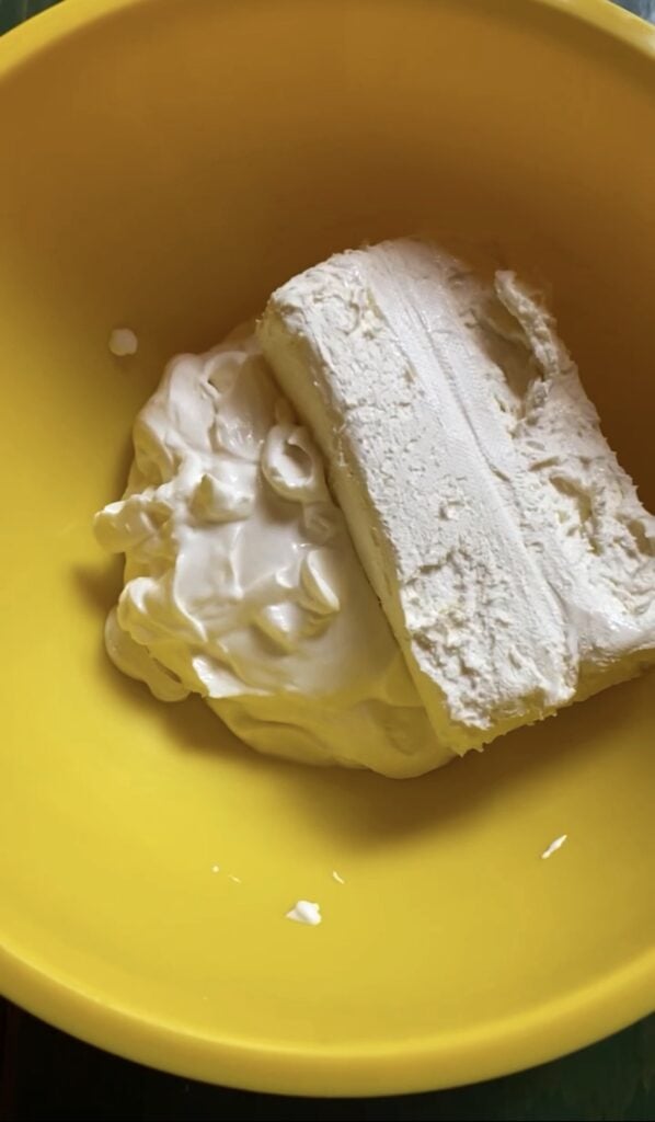 Softened cream cheese and sour cream mixed together for Dorito Chip Dip
