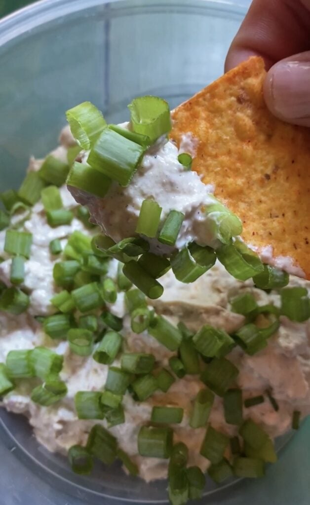 Dorito Chip Dip topped with crispy bacon green onions