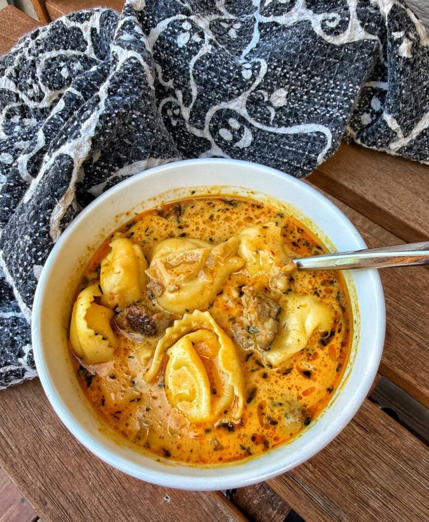 Pumpkin sausage tortellini soup served for Halloween