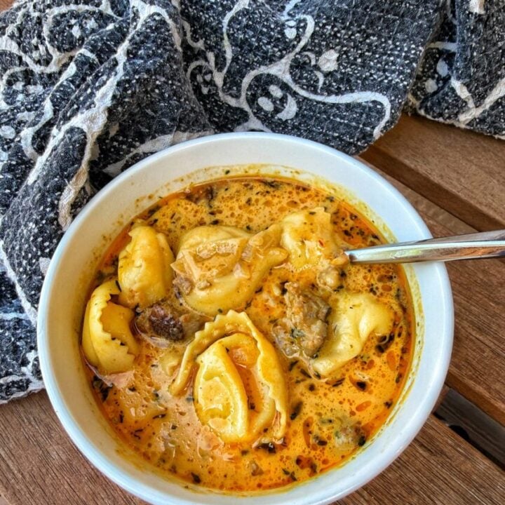 Pumpkin sausage tortellini soup served for Halloween