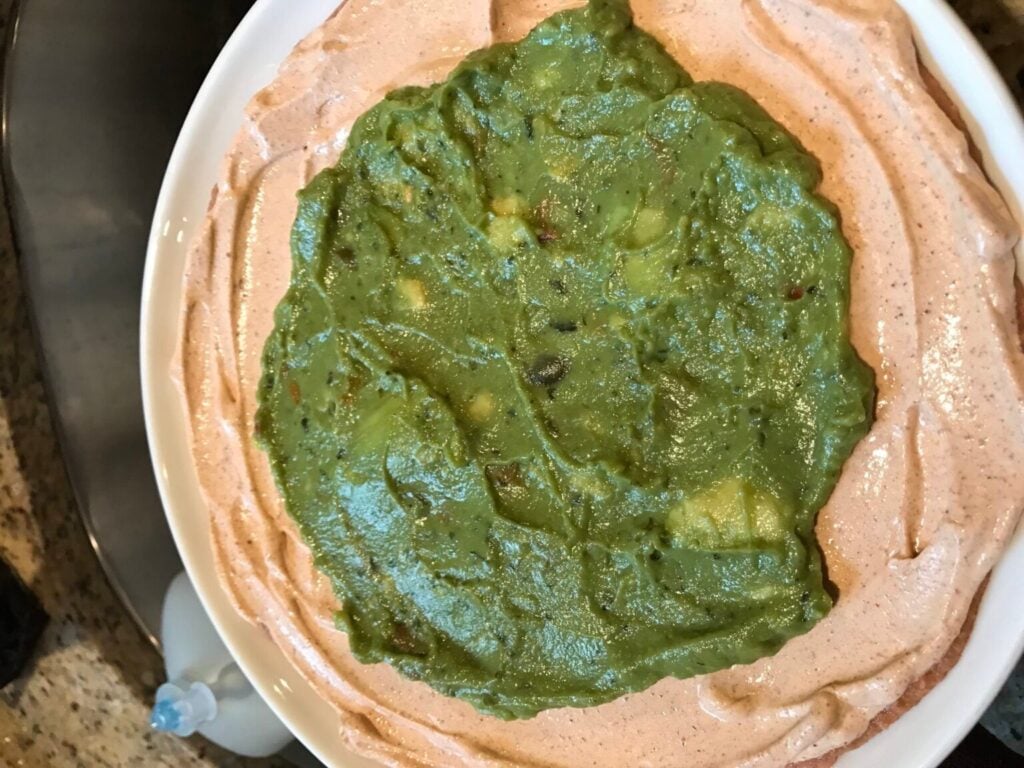 Guacamole layer in the center of Halloween Taco Dip