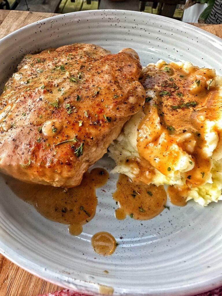 pork chops and mashes potatoes covered in a homemade gravy