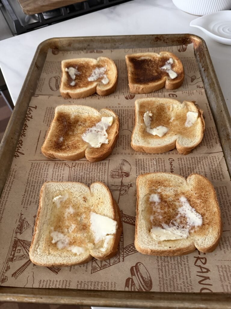 6 pieces pf toasted white bread with butter