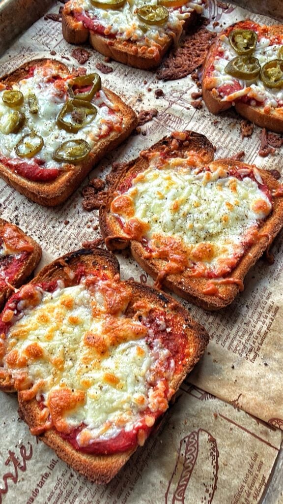 Pizza toast topped with bubbly mozzarella and hot honey pickled jalapeños.