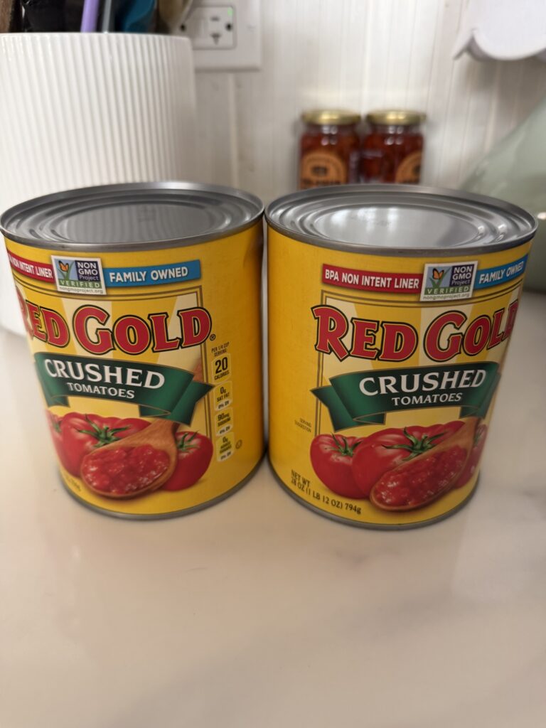 two cans of red gold brand crushed tomatoes