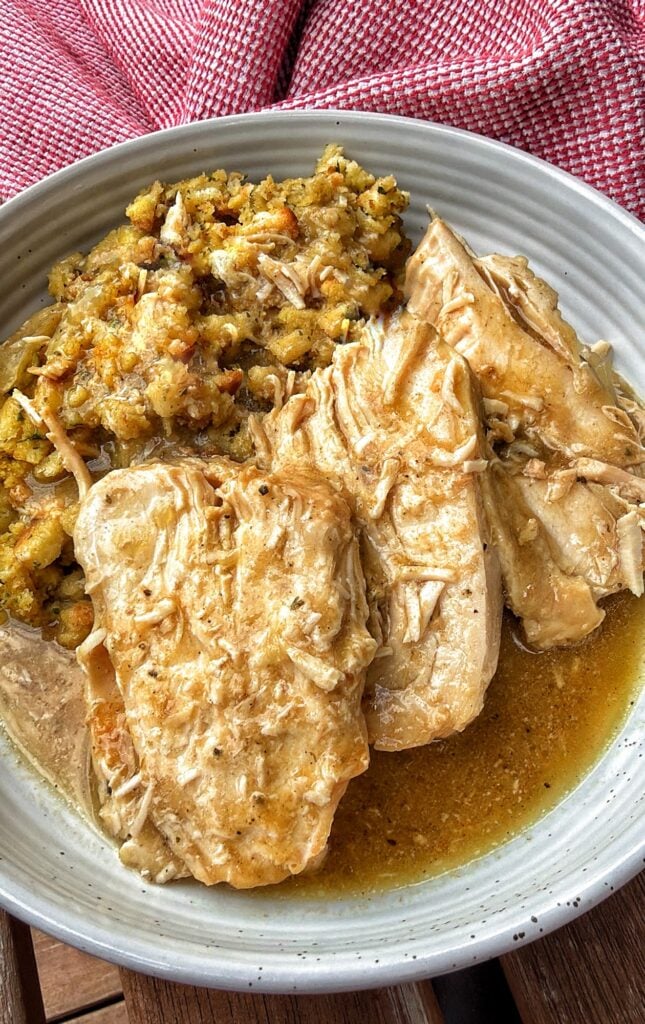 Slow cooker turkey breast in herb gravy served with stuffing