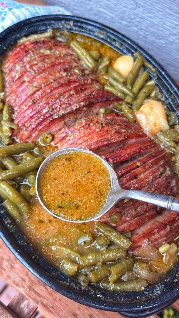 Mustard onion ham and potatoes served with a vegetable side dish.