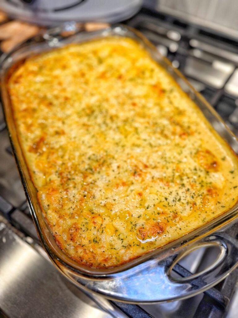 A casserole dish with swiss and lemon chicken casserole with orzo