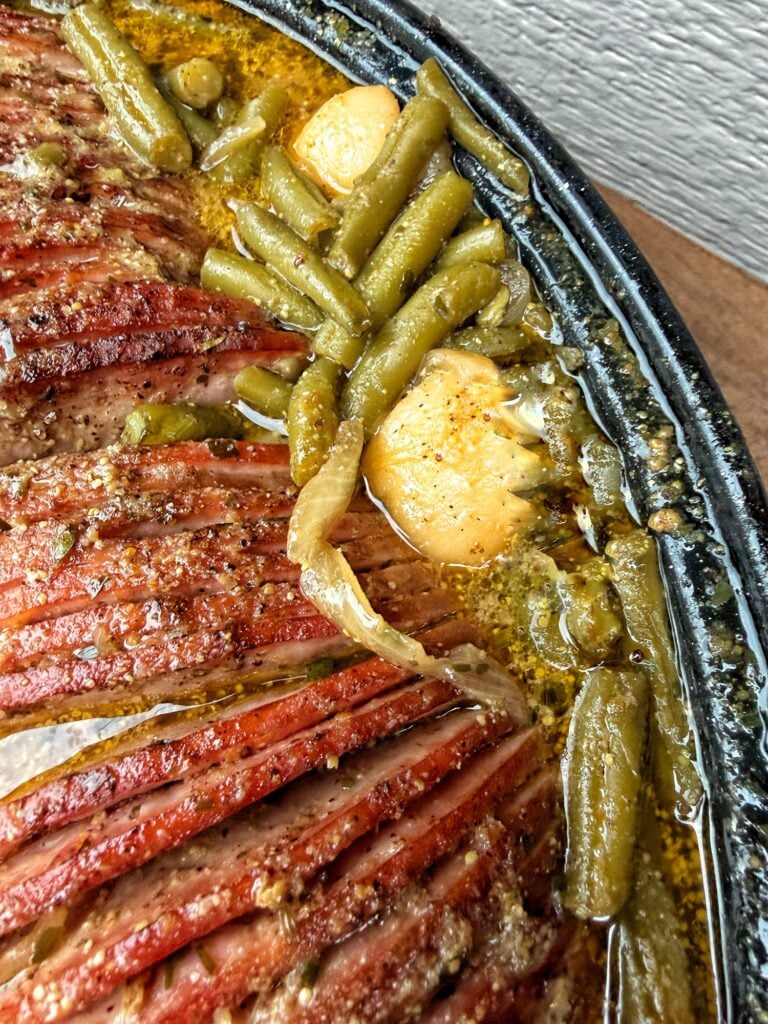 Sliced ham and potatoes with onions in a buttery Dijon mustard sauce.