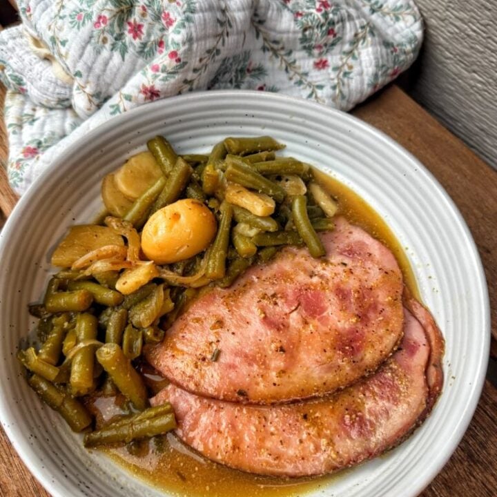 Sliced mini ham served with canned potatoes and savory mustard onion sauce