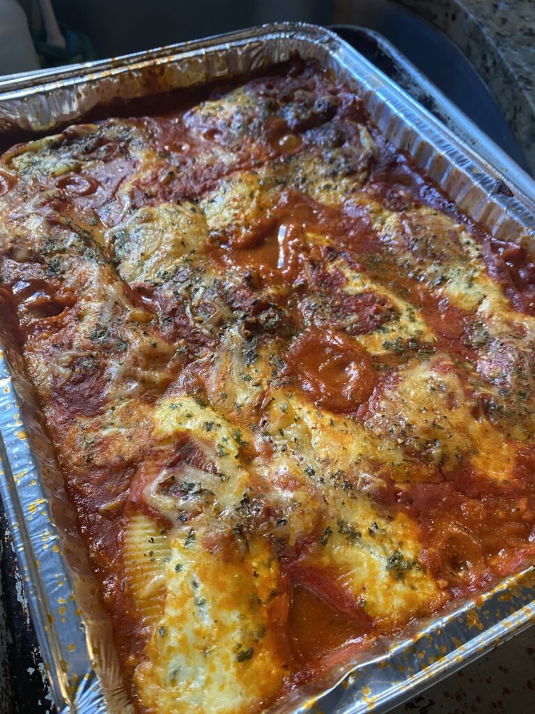 Golden baked Stuffed Shells covered in bubbling mozzarella and marinara sauce