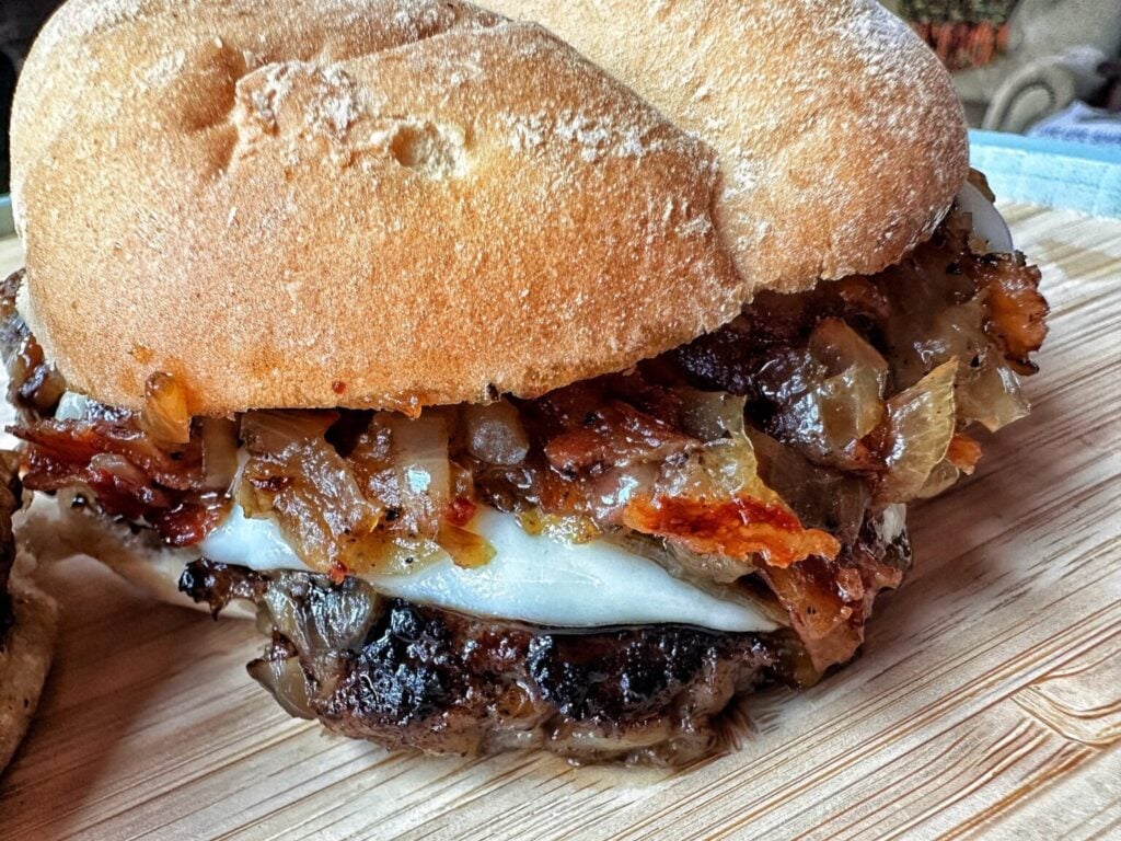 A maple bacon smash burger with caramelized onions